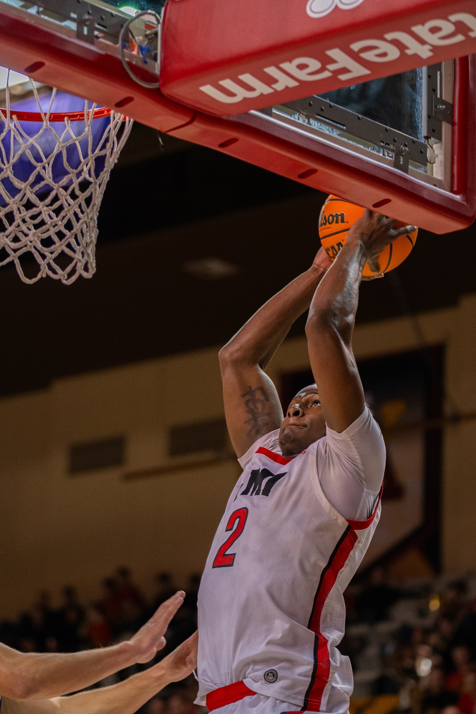 Basketball player attacking the rim
