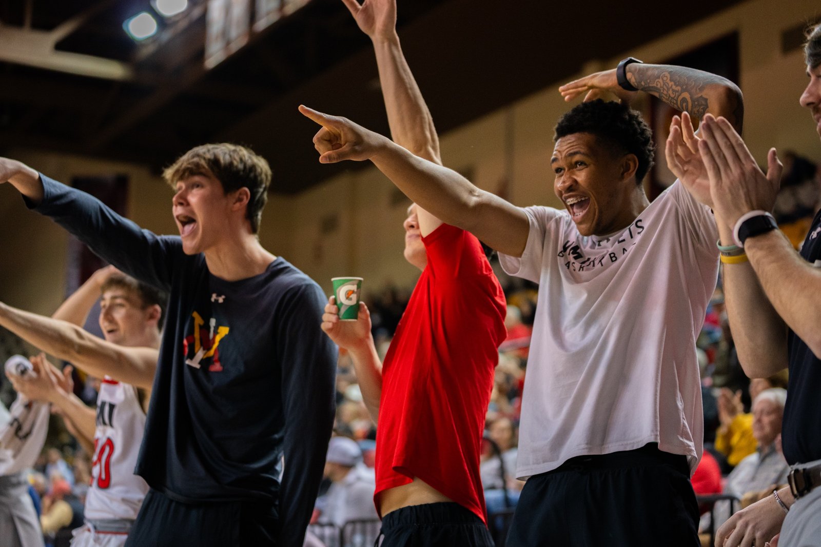 Basketball game with players and arena in full frame