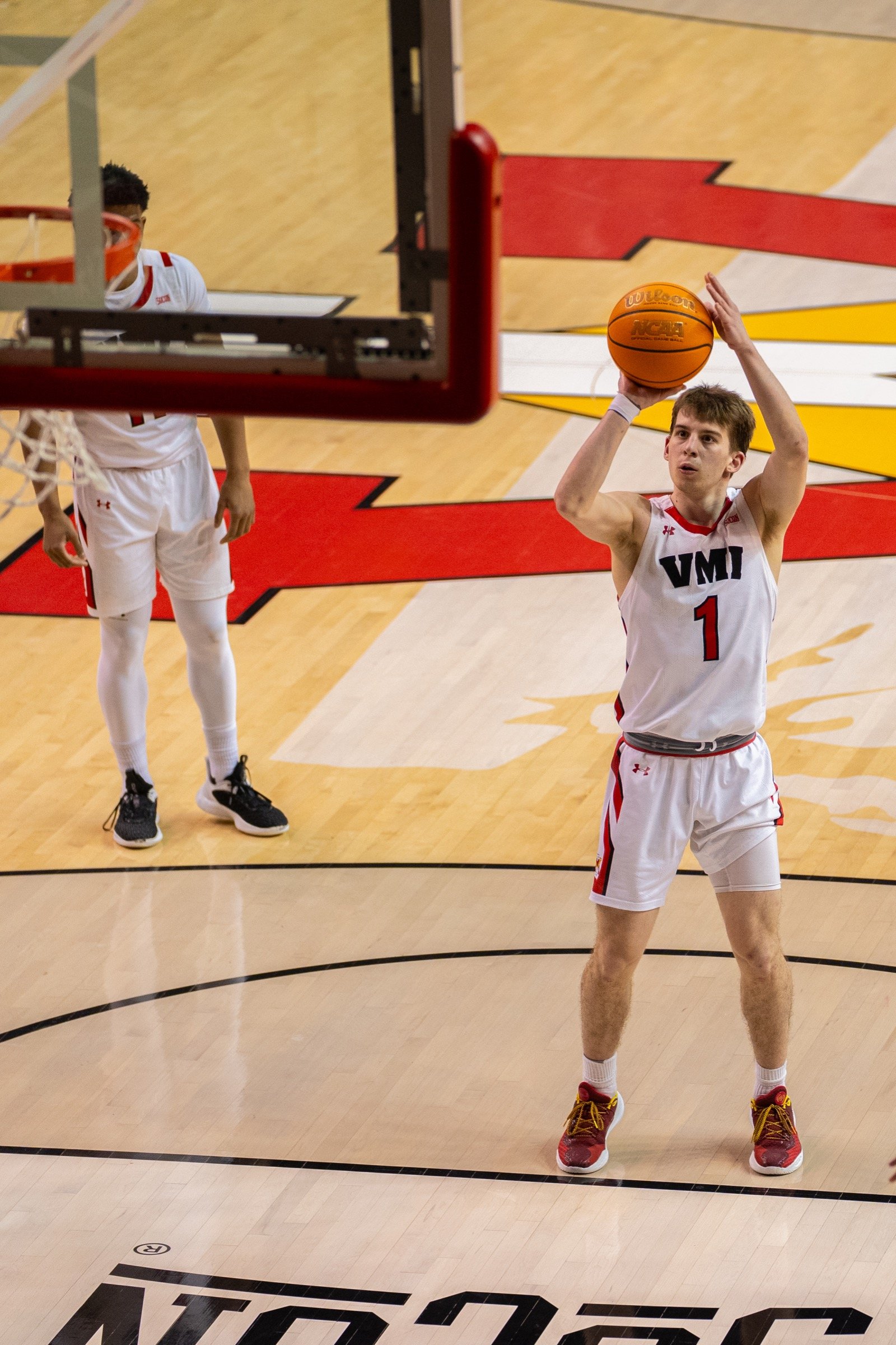Basketball player holding the ball and scanning the floor