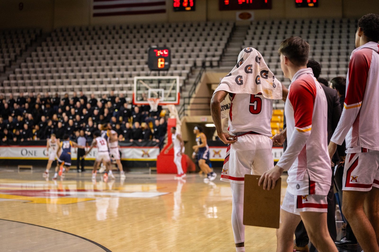 Wide basketball game frame with full arena and court