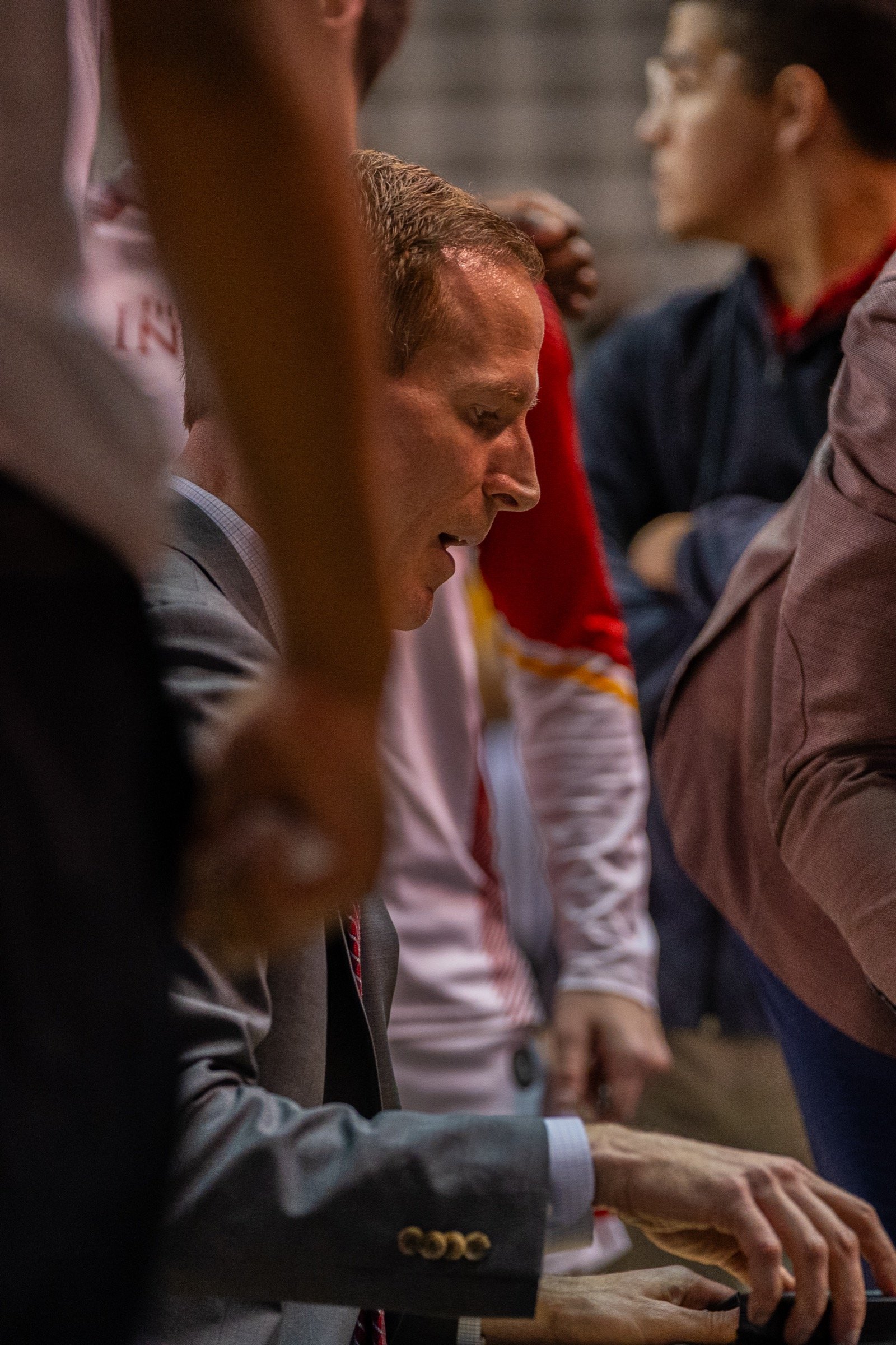Basketball player or coach on the sideline during a game